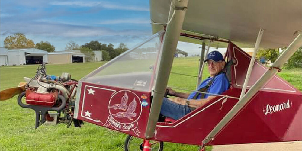A Man in a Double-Eagle Red Color Plane